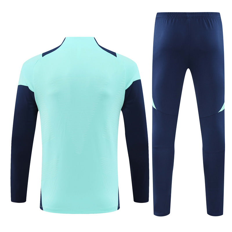Arsenal Long Sleeve 1/4 Zipped Tracksuit Cyan/Navy 2024-25
